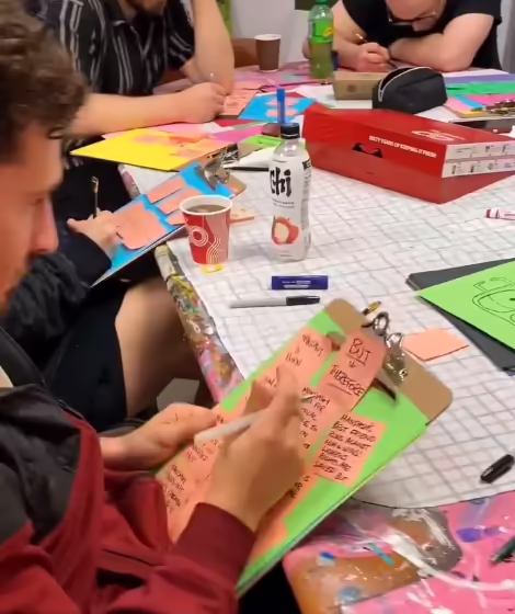 Artist Michael Rillo planning his short story using post-it notes