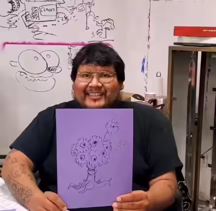 Artist Dope Chief presenting his fluffy eyeball character