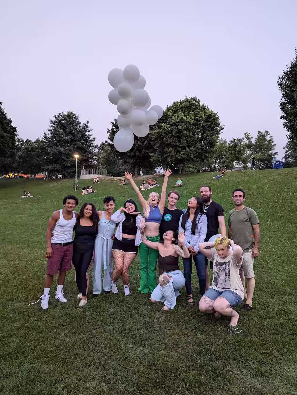 Group photo with cloud enjoyers, with Liza tossing the cloud sculpture into the sky
