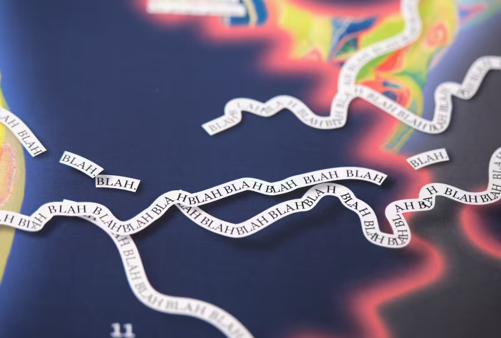 Closeup of Hijinx World magazine spread. Words 'BLA BLA BLA' squiggle all over the page.