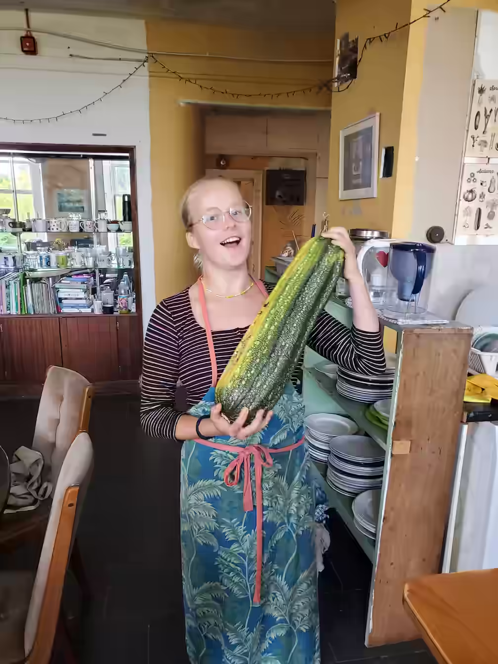Liza holding a very big zucchini